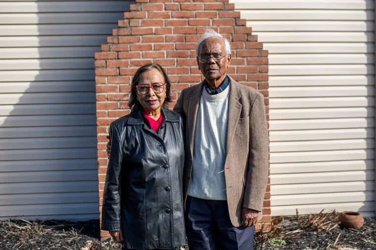 Arun Deb, (right), 84, and his wife Dhriti Deb, 77, (left), pose for a portrait outside their home in Downingtown. Arun, an environmental engineer and water expert, has used his own time and money to bring safe water, sanitation, and better lives to residents in West Bengal, India, where he was born.
