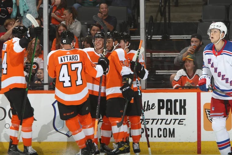 From left to right, defenseman Egor Zamula, defenseman Ronnie Attard, winger Olle Lycksell, winger Zayde Wisdom, and center Elliot Desnoyers celebrate a goal in the second period of the Flyers' win over the Rangers rookies.