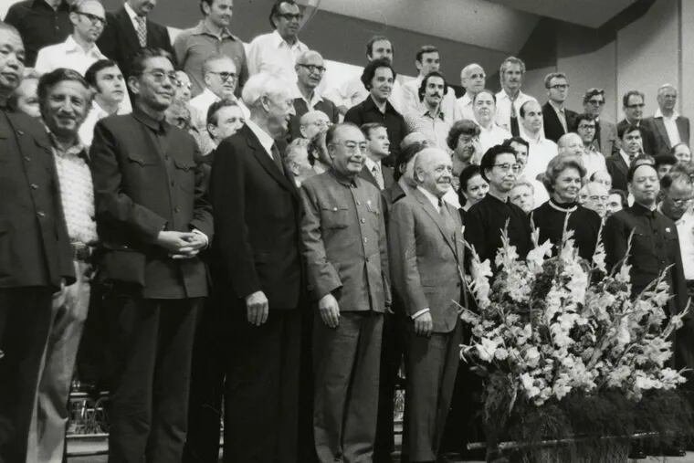 Music diplomacy: Members of the Orchestra on stage with dignitaries after the orchestra's Sept. 16, 1973, concert in Beijing, China. In the front row, center, behind the flowers, are (left to right): Eugene Ormandy, conductor of the orchestra; Jiang Qing, better known as Madame Mao; and Gretel Ormandy, wife of the conductor.