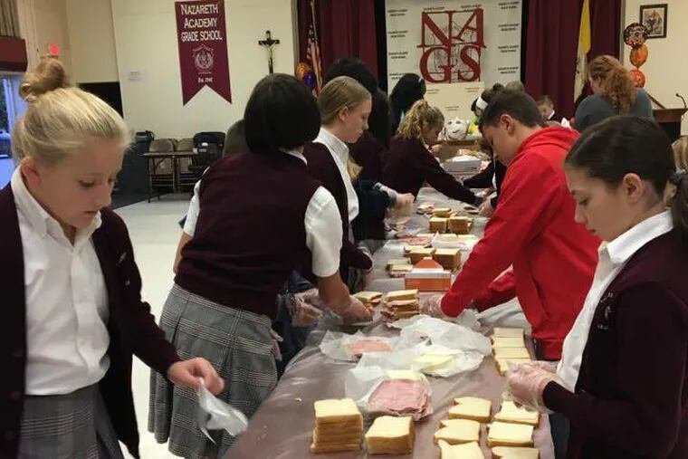 On Oct. 7, students at Nazareth Academy Grade School packed 200 lunches as part of a monthly service project aimed at helping to feed the needy.