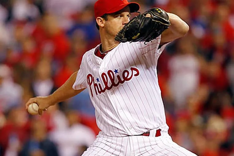 Roy Oswalt struck out nine batters and scored a run in the Phillies' win. (Yong Kim/Staff Photographer)