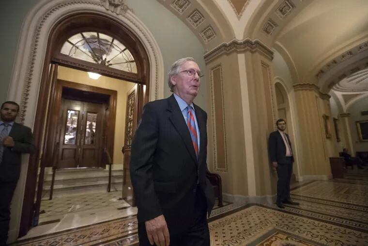 Senate Majority Leader Mitch McConnell of Ky. leaves the Senate chamber after a vote as Republicans remained stymied in their push to repeal and replace Obamacare.