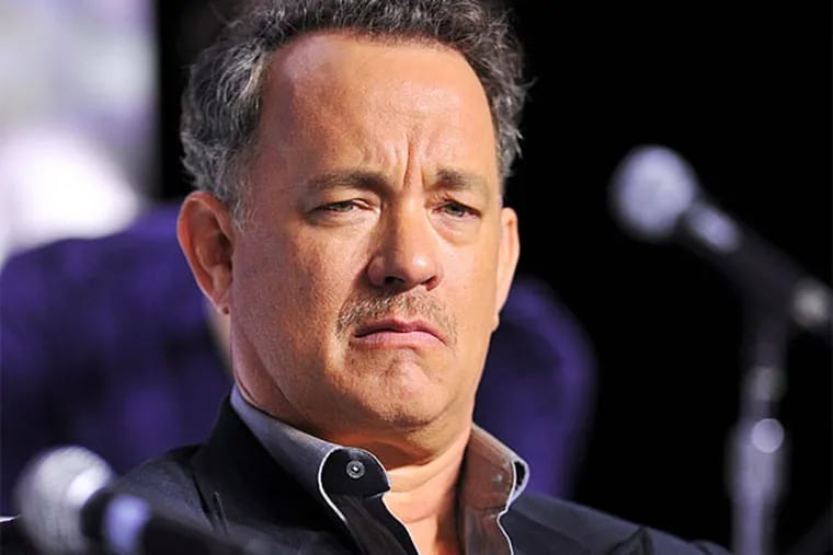 Actor Tom Hanks listens during the press conference for the film "Cloud Atlas" during the 2012 Toronto International Film Festival in Toronto on Sunday, Sept. 9, 2012. (AP Photo/The Canadian Press, Aaron Vincent Elkaim)