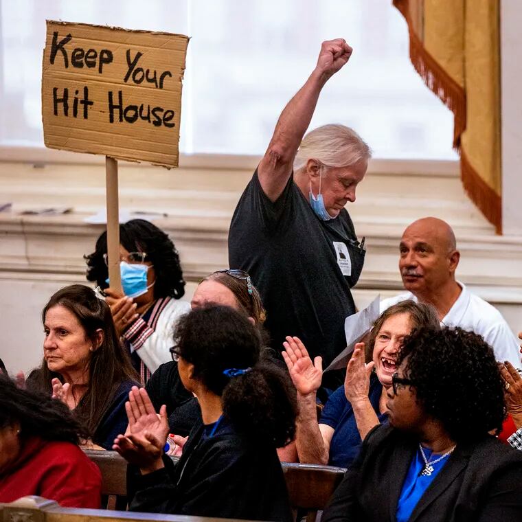 Alfred Klosterman, a 30-year resident of the Harrowgate neighborhood who opposes supervised drug consumption sites, raises his fist after addressing City Council on Sept. 14.