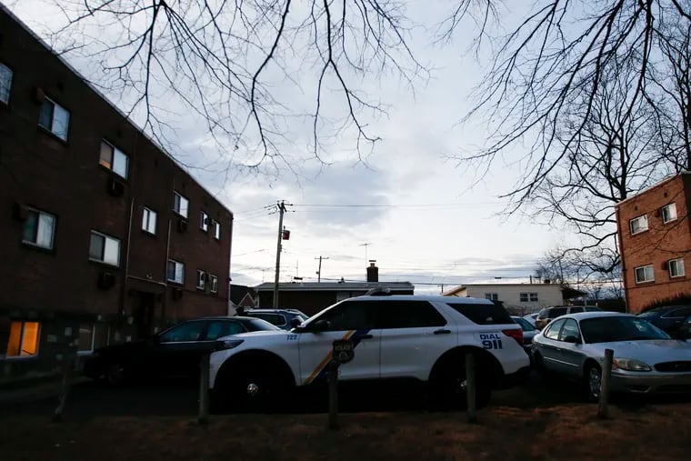 Philadelphia Police stand guard outside the Michner Court Apartments in Northeast Philadelphia after two people were found shot dead on Friday, January 22, 2021. A maintenance worker found a male and female with gun shots to the head.