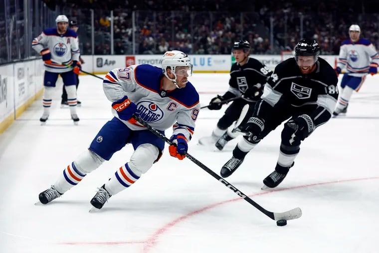ACTION NETWORK USE ONLY Connor McDavid #97 of the Edmonton Oilers skates the puck against the Los Angeles Kings in the first period at Crypto.com Arena on April 04, 2023 in Los Angeles, California. (Photo by Ronald Martinez/Getty Images)