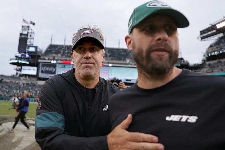 Eagles head coach Doug Pederson, left, meets New York Jets head coach Adam Gase, right, in the middle of the field after the game. Philadelphia Eagles win 31-6 over the New York Jets at Lincoln Financial Field on October 6, 2019.