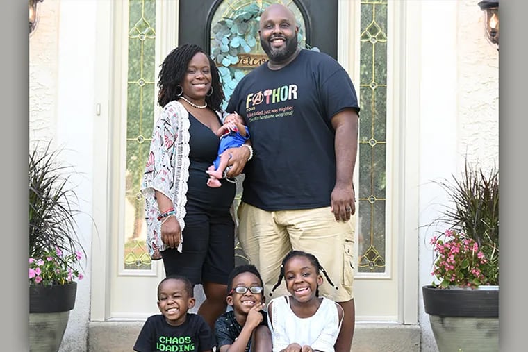 Karen and Daryl Leggett with infant Dorian and kids (from left) Cameron, Daryl III (Tre) and Camille.