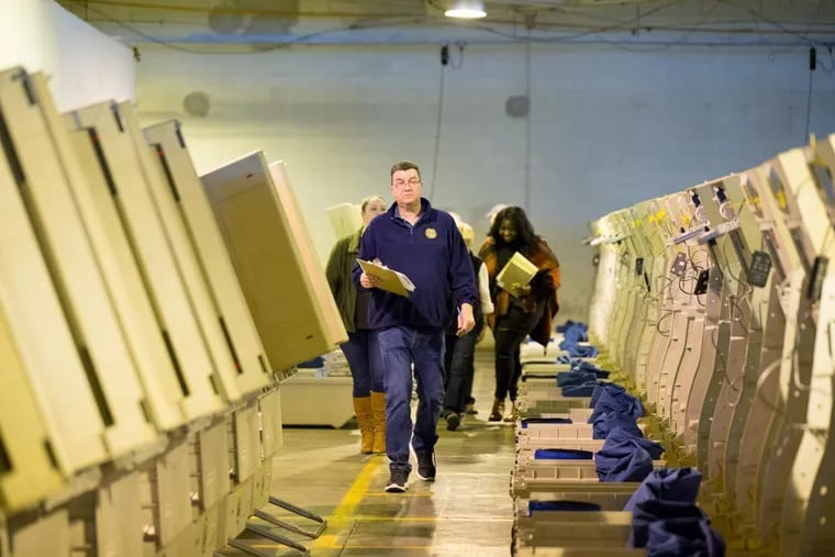 ‘Pennsylvania.;s election officials say Russian hackers were likely targeting voter registration information, rather than voting machines. Pictured above are voting machines in Philadelphia during the 2016 election.
