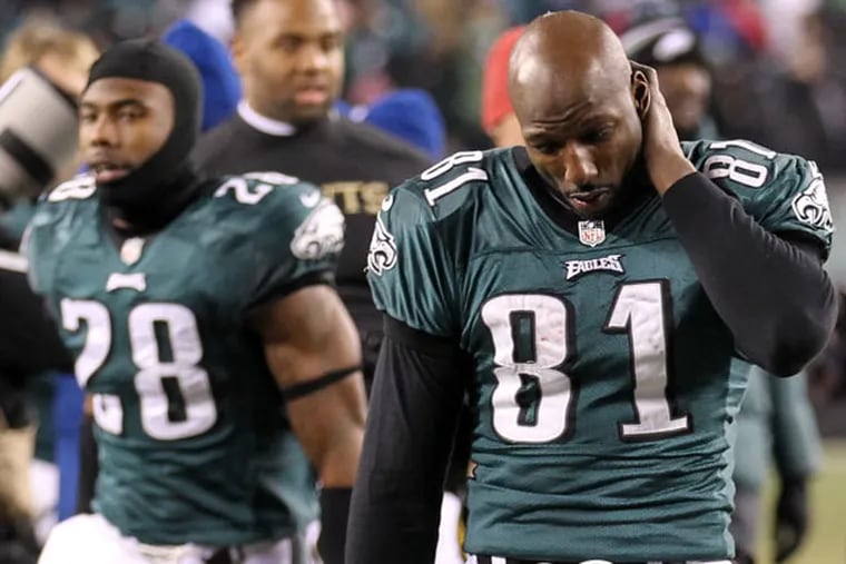 Jason Avant walks off the field dejected after losing to the Saints. (Yong Kim/Staff Photographer)