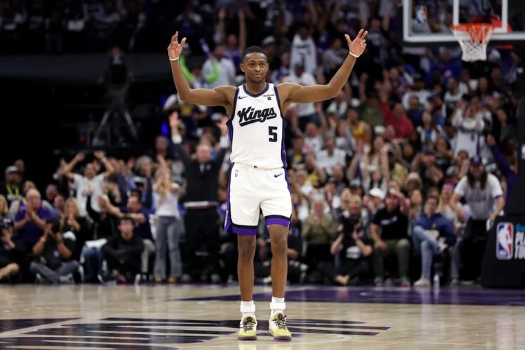 De'Aaron Fox #5 of the Sacramento Kings reacts after the Kings made a basket against the Golden State Warriors in the second half during the Play-In Tournament at Golden 1 Center on April 16, 2024 in Sacramento, California.