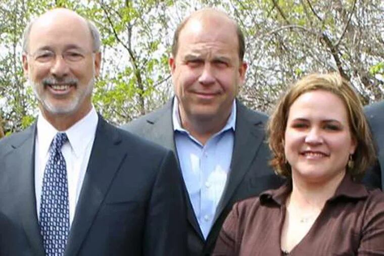 Lolly Bentch (right) was hired by the state Department of Health to serve as patient liaison for the state medical marijuana program. Bentch stands with Gov. Wolf and medical marijuana bill sponsor state Sen. Daylin Leach in this photo, taken after the bill was signed into law in April.