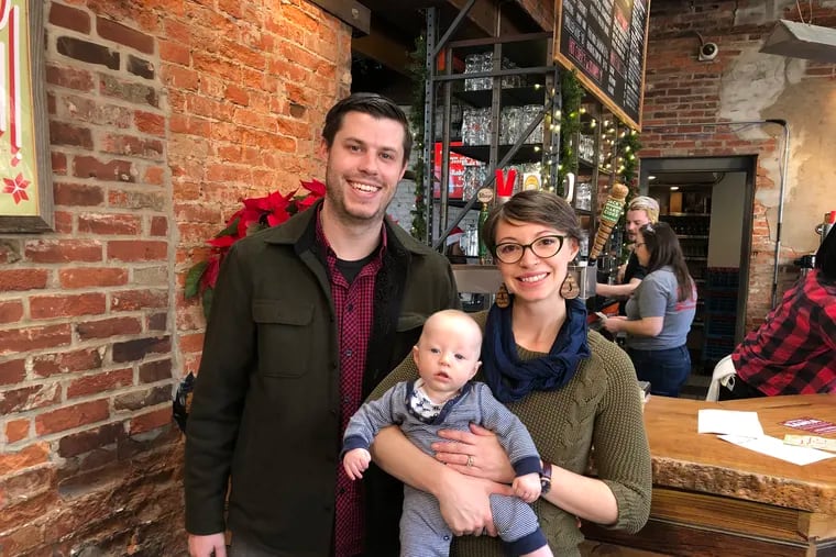 Tonya and Tyler with Oliver at Frankford Hall, waiting to have a picture taken with Santa.