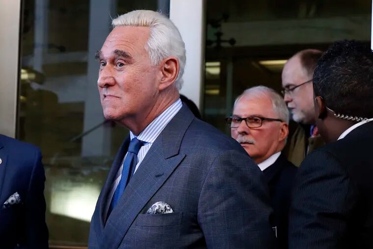 Former campaign adviser for President Donald Trump, Roger Stone, leaves federal court Thursday, Feb. 21, 2019, in Washington. A judge has imposed a full gag order on Trump confidant Roger Stone after he posted a photo on Instagram of the judge with what appeared to be crosshairs of a gun. (AP Photo/Jacquelyn Martin)