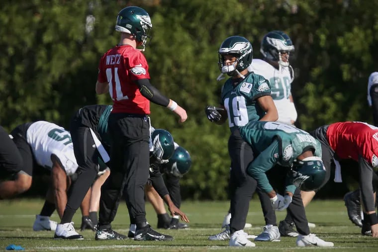 Eagles quarterback Carson Wentz (11) talks with new wide receiver Golden Tate (19) during practice at the NovaCare Complex in South Philadelphia on Thursday, Nov. 8, 2018. TIM TAI / Staff Photographer