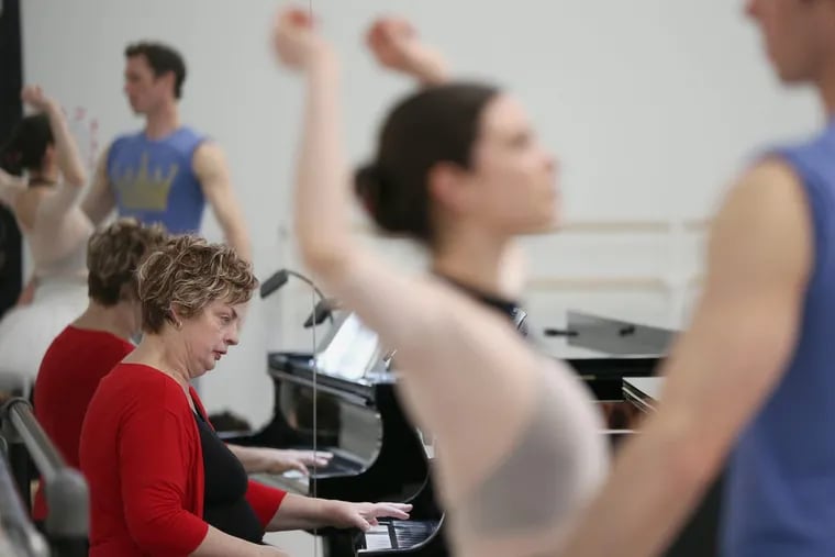 Pennsylvania Ballet principal pianist Martha Koeneman rehearses the ballet “Jewels” with dancers at their practice facility.