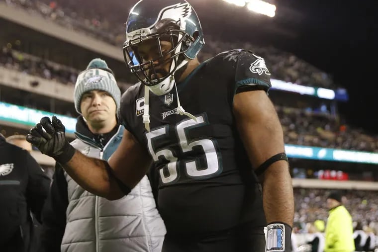 Eagles defensive end Brandon Graham leaves the field after injuring his ankle against the Oakland Raiders on Christmas night.