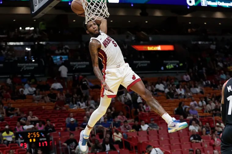 Derrick Jones lays in a huge alley-oop dunk during the Heat's loss to the Raptors on Sunday in Miami.