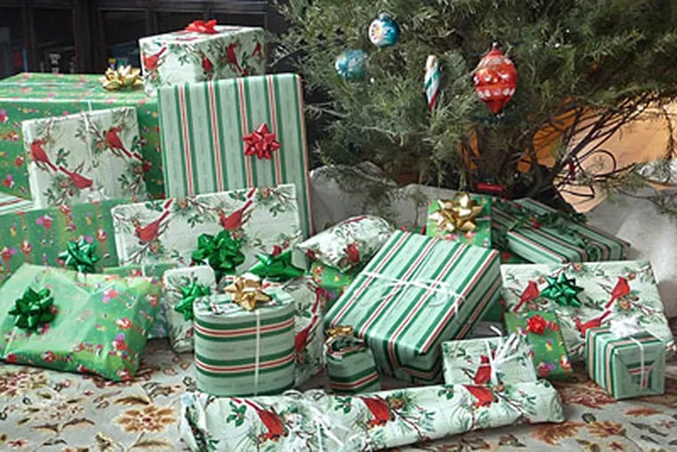 Wrapped presents under a tree are an iconic image of Christmas. (Russ Burden/Digital Photo Academy/MCT)