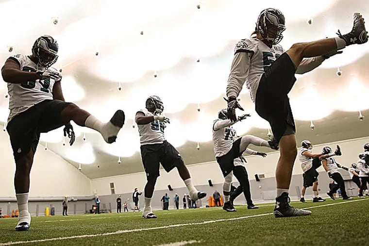 The Eagles stretch for practice at the NovaCare Complex. (David Maialetti/Staff Photographer)