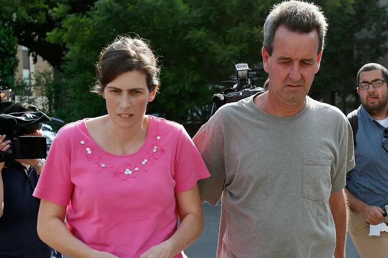 Catherine and Herbert Schaible were charged with third-degree murder, involuntary manslaughter and other charges in the death of another son, Brandon, in April. They are seen here turning themselves in at Philadelphia police headquarters in Philadelphia on May 22, 2013.  ( DAVID MAIALETTI / Staff Photographer )