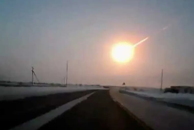 In this frame grab made from a dashboard camera, on a highway from Kostanai, Kazakhstan, to Chelyabinsk region, Russia, provided by Nasha Gazeta newspaper, on Friday, Feb. 15, 2013 a meteorite contrail is seen. A meteor streaked across the sky of Russia’s Ural Mountains on Friday morning, causing sharp explosions and reportedly injuring around 1,100 people, including many hurt by broken glass. (AP Photo/Nasha gazeta, www.ng.kz)