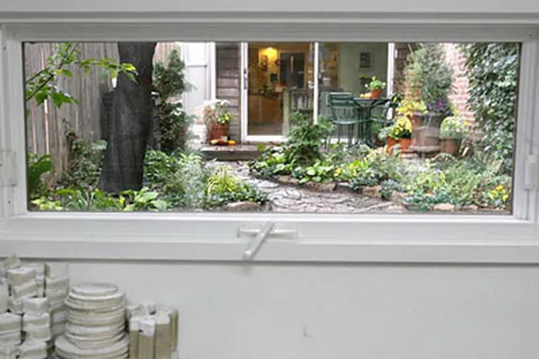 The view from the ceramic studio of Teresa Chang's looking towards the garden and home. ( Charles Fox / Staff Photographer )