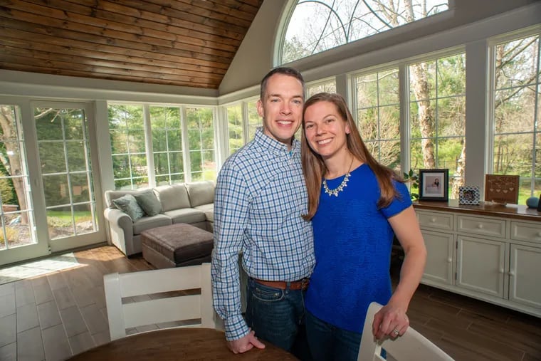 Andrew and Emily Buschmeier wanted to enjoy the nearby woods, but mosquitos were a problem. Their new sunroom, filled with windows, has a stained pine ceiling and a heated, wood-patterned floor.