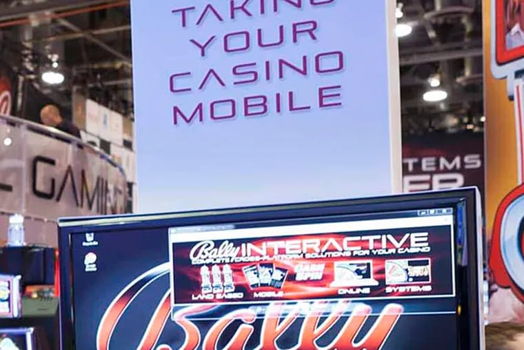 Mobile and online gambling is demonstrated at a Las Vegas conference.