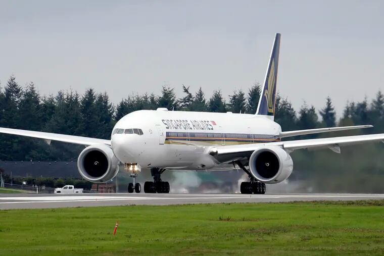 A Singapore Airlines Boeing 777-312ER readies to take off from Paine Field in Everett, Wash., in 2013.