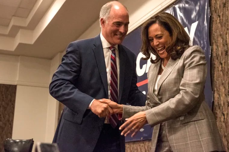 U.S. Sen. Bob Casey exits the stage with U.S. Sen. Kamala Harris at his campaign event at the AME Church Ninth Episcopal District Headquarters on Friday, July 13, 2018.