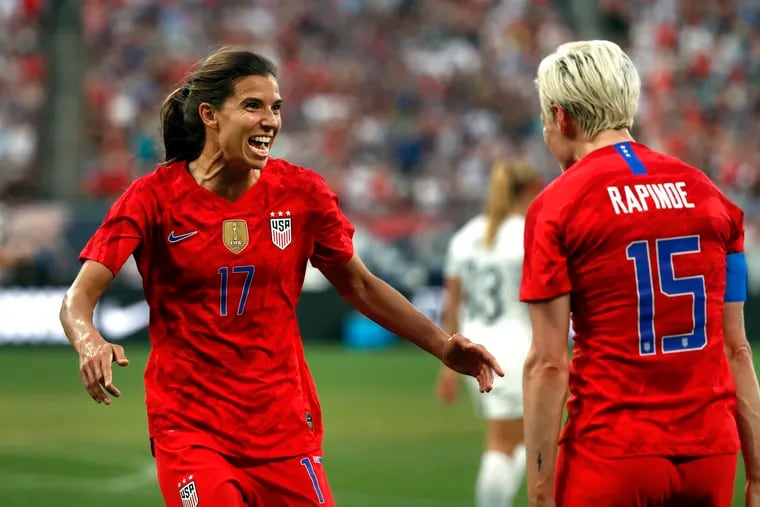 Tobin Heath (left) celebrates with Megan Rapinoe after scoring the United States' first goal against New Zealand. Rapinoe had the assist.
