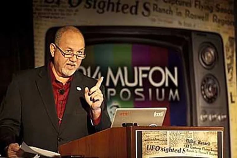 John Ventre, state director of the Mutual UFO Network, addresses an audience gathered for the 45th annual conference of the International Mutual UFO Network at the Crowne Plaza Hotel in Cherry Hill. ( RON TARVER / Staff Photographer ) July 19 2014