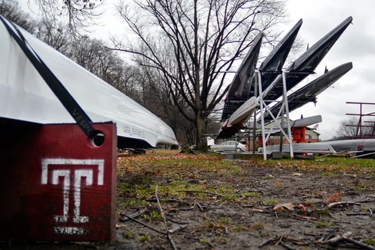 Temple University Crew team boats are stored outside, near their temporary tents along the Schuylkill River December 6, 2013. In a stunning move, Temple killed seven of its 24 intercollegiate sports programs including rowing. The decision to eliminate men and women's
rowing is in large part due to lack of a proper facility. Temple had shared a canoe club that was condemned, and since that time, its program has operated out of these tents and the school has been unsuccessful in securing land and funding for a new boathouse. (Tom Gralish/Staff Photographer)