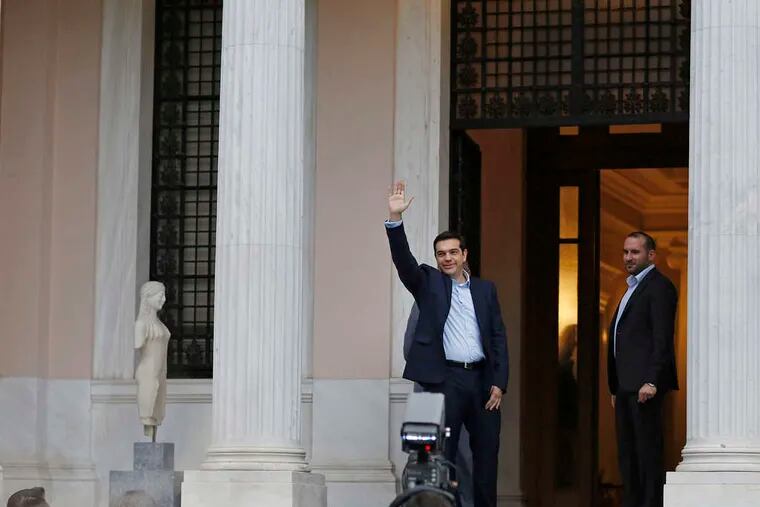 Alexis Tsipras , Greece's new anti-austerityprime minister, waves to supporters in Athens. On his first day in office, the 40-year-olddid much differently. Story, A6. Bloomberg