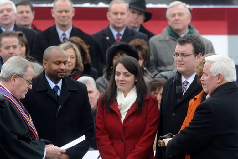 Gerald Gibson (second from left) stood on the platform with his wife Katherine as her father, Tom Corbett (right), tok the oath of office as Pennsylvania governor in January 2011. Gibson was caught allegedly stealing money in a sting operation. (Guy Wathen / Tribune-Review)