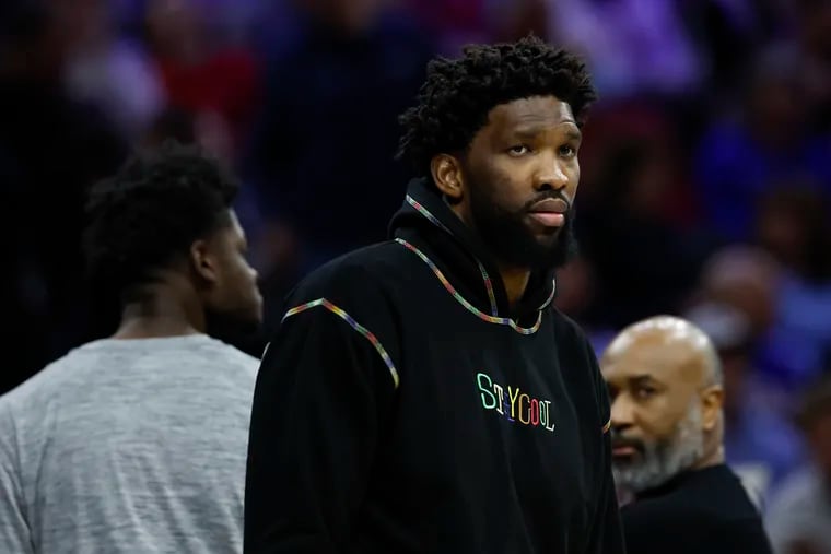Injured Sixers center Joel Embiid during a break in the action against the Charlotte Hornets on Friday.