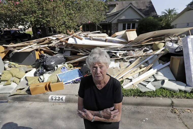 Arlene Estle outside her Houston home, which was damaged by flood waters from Hurricane Harvey.