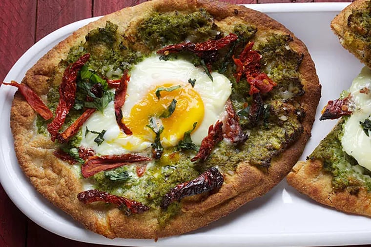 Broccoli, sun-dried tomato and egg enliven this pizza. (Deb Lindsey/Washington Post)