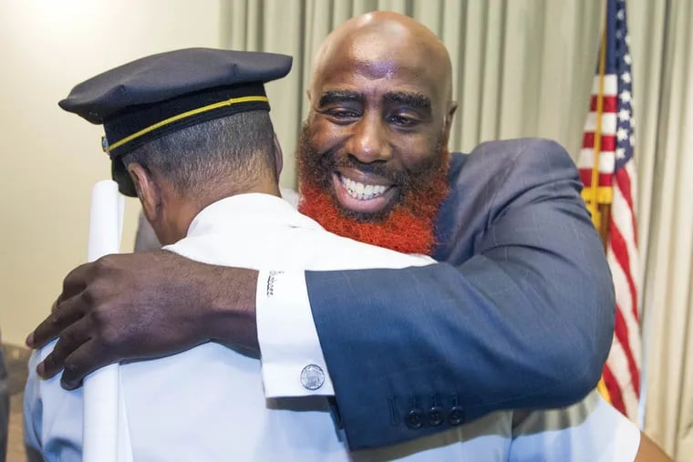 Tariq El-Shabazz, to be ranking deputy later this year, with Police Commissioner Richard Ross.