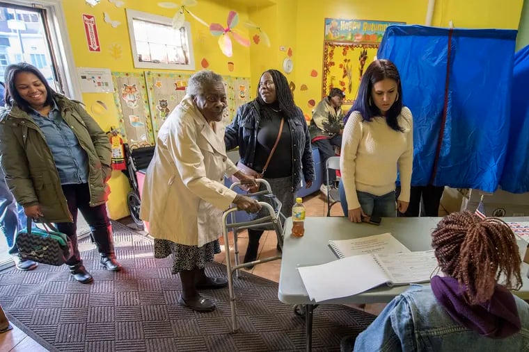 88 year old Mary Holloway waits with her daughter Brenda Jeffries to vote at her polling place on North Broad Street near Elser Street in North Philadelphia in 2016.