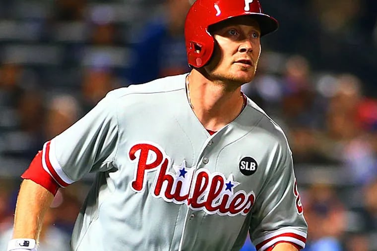 Philadelphia Phillies third baseman Cody Asche (25) watches his solo home run in the fourth inning against the New York Mets at Citi Field. (Andy Marlin/USA Today)