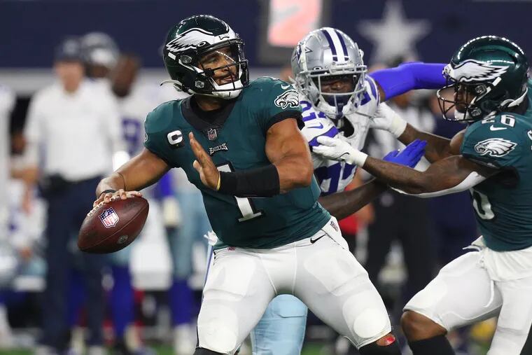 Jalen Hurts of the Philadelphia Eagles throws a pass while playing the Dallas Cowboys at AT&T Stadium on September 27, 2021 in Arlington, Texas. (Photo by Richard Rodriguez/Getty Images)