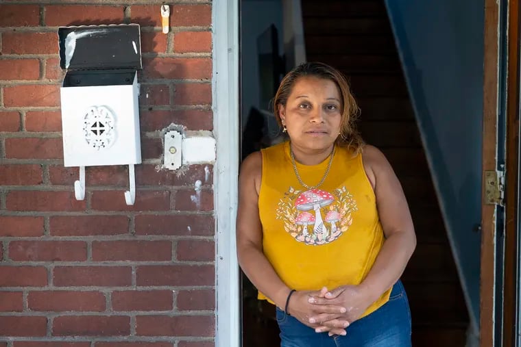 Irma Domingo Cax, who is fighting to stay in the United States after fleeing violence in Guatemala, stands in the doorway of her home in Pittsburgh on July 14, 2022. A friend drove her from Pittsburgh to Philadelphia to attend an immigration court hearing, since the federal government is no longer holding in-person hearings in Pittsburgh.