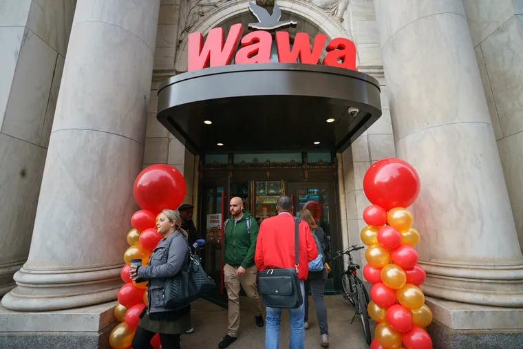 Customers exit Wawa at 6th and Chestnut Streets, on Wawa day, in Philadelphia, April 11, 2019.