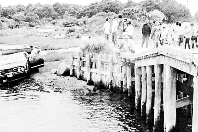 Kennedy's car is pulled from the water after it ran off a bridge on Chappaquiddick Island. Kopechne had been found near a backseat wheel well, an apparent victim of suffocation.