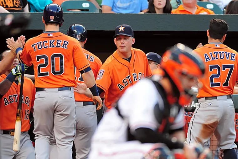 Houston Astros manager A.J. Hinch (14) high fives outfielder Preston Tucker (20) after scoring a run in the seventh inning against the Baltimore Orioles at Oriole Park at Camden Yards. The Orioles won 5-4. (Evan Habeeb/USA Today)