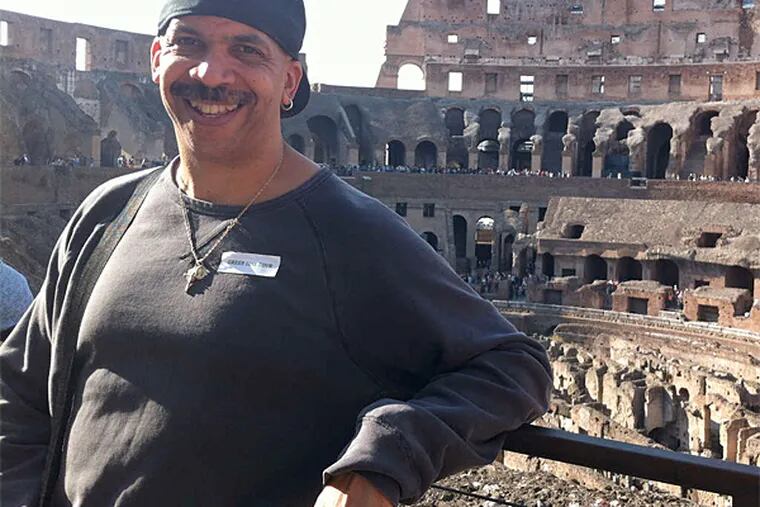 Bill Jolly at the Coliseum in Rome. He's visited nearly 50 destinations around the world - all for free.