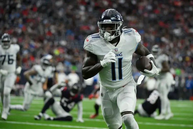 Tennessee Titans wide receiver A.J. Brown (11) runs for a touchdown against the Houston Texans during the first half of an NFL football game, Sunday, Jan. 9, 2022, in Houston. (AP Photo/Justin Rex )