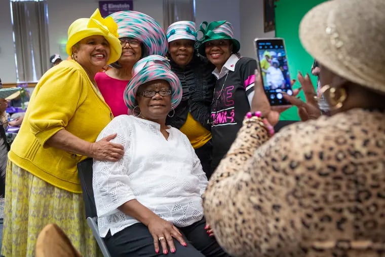 (From left, clockwise) The Rev. Georgiette Morgan-Thomas, owner of American Hats LLC, poses for a photo with fellow cancer survivors Helen Dean, Dionne Moses, DeBorah Spicer-Sanders, and Vanessa Alston at Einstein Medical Center Philadelphia Friday during the annual Cancer Survivors Day banquet. This year's theme was "Hats Off to Survivors." The hats were made by American Hats and donated by Morgan-Thomas, a two-time cancer survivor.